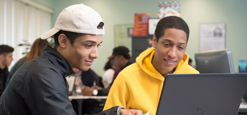 Students in front of computer.